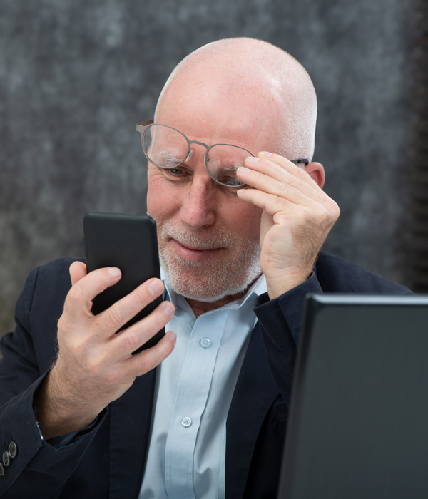 man squinting to read