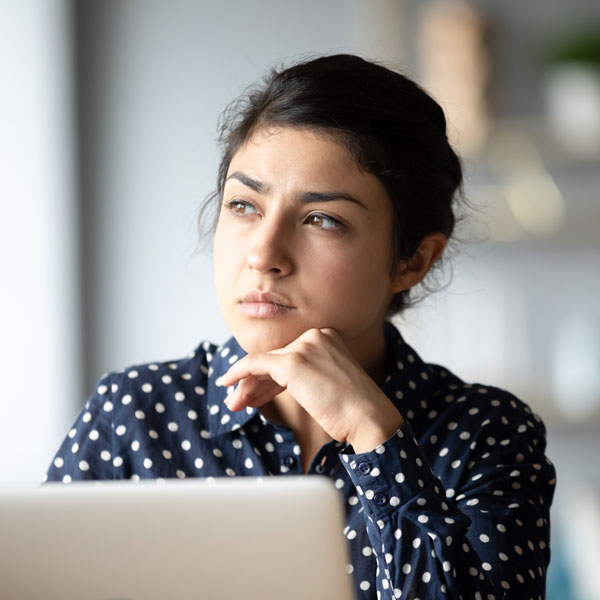 woman looking away from computer
