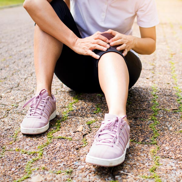 person holding knee