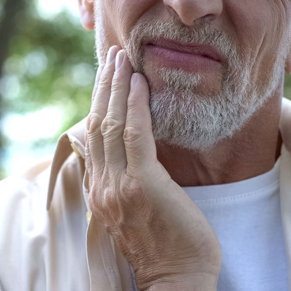 guy with jaw pain