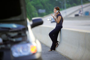 woman on phone after car trouble